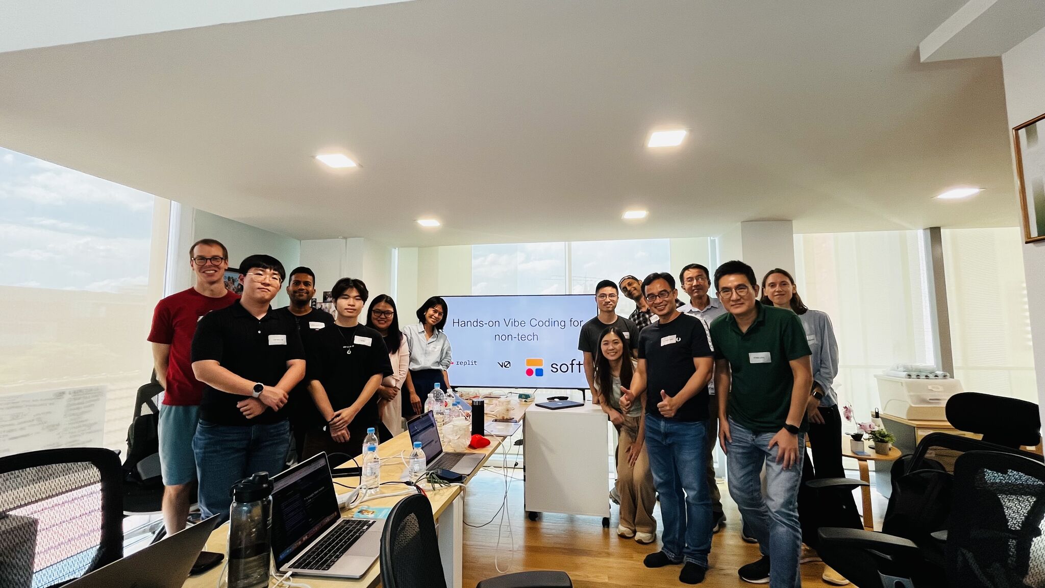 Hands-on Vibe Coding workshop participants - diverse group of professionals learning to build applications with AI